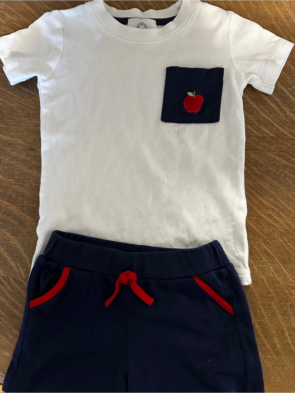 Proper Peony Back to School Set
White Tee with Navy Pocket & Red Apple Accent